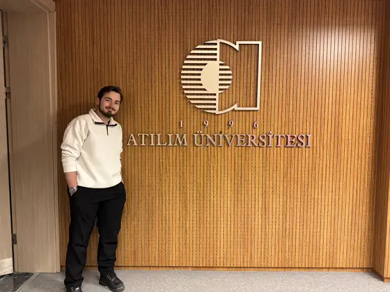 By the university sign