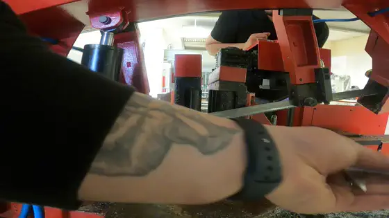 Reaching in to clear the cut