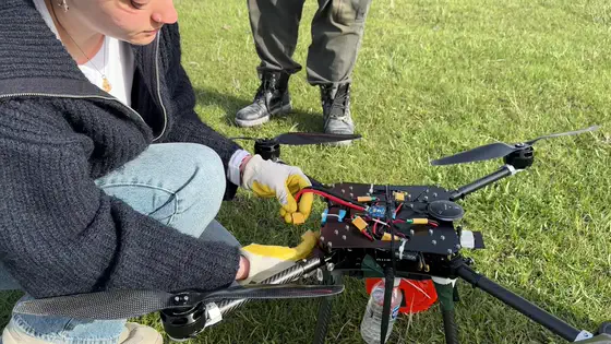 Gloved hands on the airframe