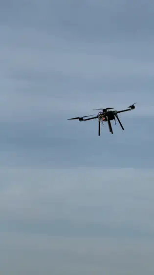Close overhead — rotors turning