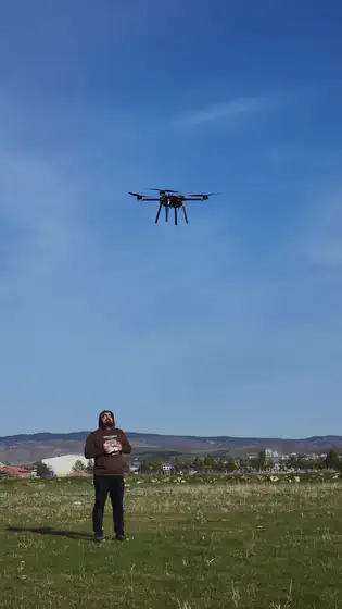 Pilot and aircraft, mid-hover